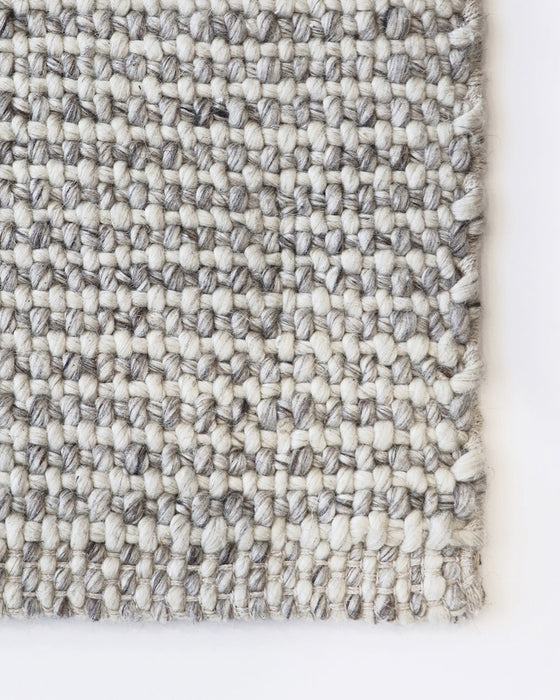 Kansas Floor Rug in Oyster/Natural, close-up of a corner showing the edge and wool and viscose pile