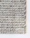 Kansas Floor Rug in Oyster/Natural, close-up of a corner showing the edge and wool and viscose pile