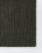 Linden Floor Rug in Petrol, close-up of a corner showing the edge and wool pile