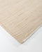 Lonsdale Floor Rug in Almond, close-up of a corner showing the edge and recycled PET pile