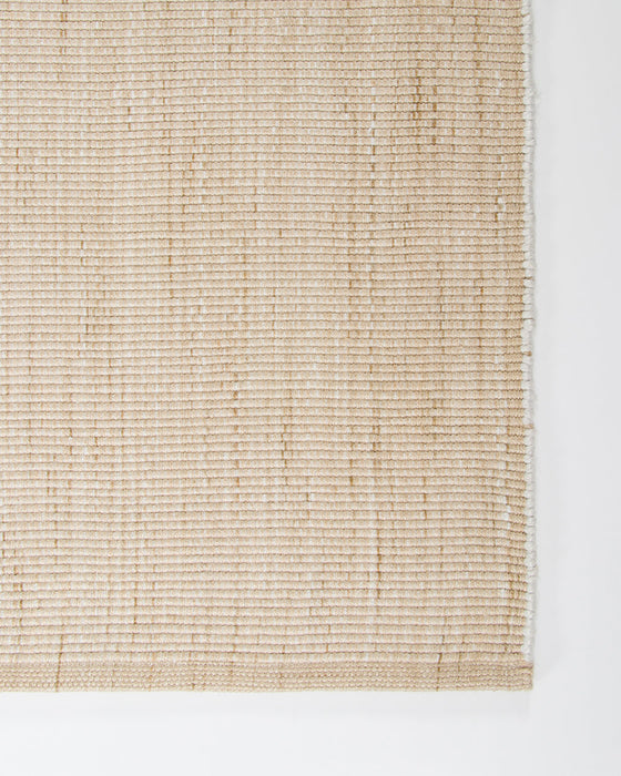 Lonsdale Floor Rug in Almond, close-up of a corner showing the edge and recycled PET pile