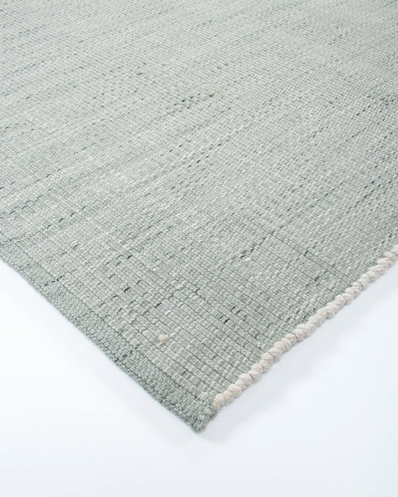 Lonsdale Floor Rug in Eucalyptus, close-up of a corner showing the edge and recycled PET pile