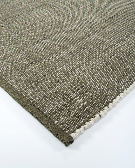 Lonsdale Floor Rug in Olive, close-up of a corner showing the edge and recycled PET pile