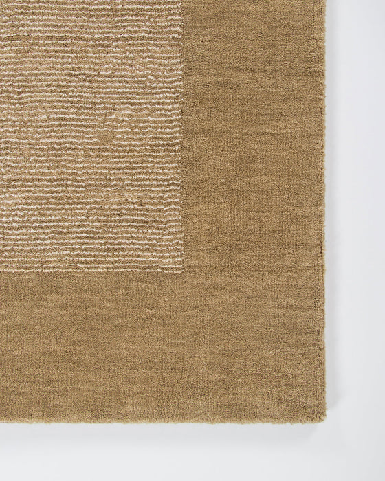 Mayfair Floor Rug in Wheat, close-up of a corner showing the edge and linen and wool pile