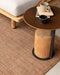 Lonsdale Floor Rug in Cumin, under a round timber side table beside an outdoor daybed