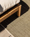 Lonsdale Floor Rug in Olive, close view under an outdoor timber sofa, showing the weave