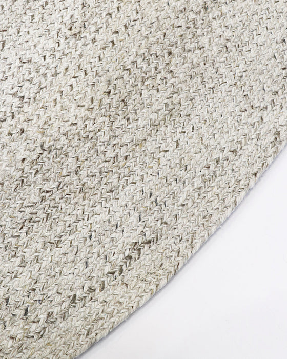 Mornington Round Floor Rug in Pale Sand, close-up of the curved edge and recycled PET weave