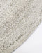 Mornington Round Floor Rug in Pale Sand, close-up of the curved edge and recycled PET weave