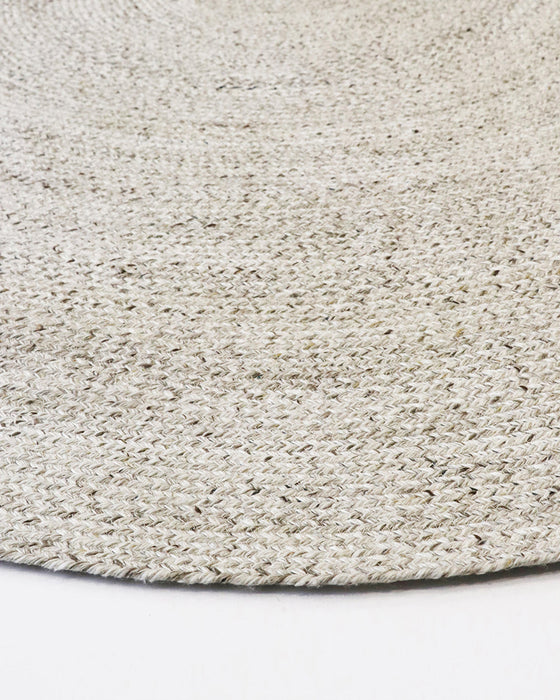 Mornington Round Floor Rug in Pale Sand, close-up of the curved edge and recycled PET weave
