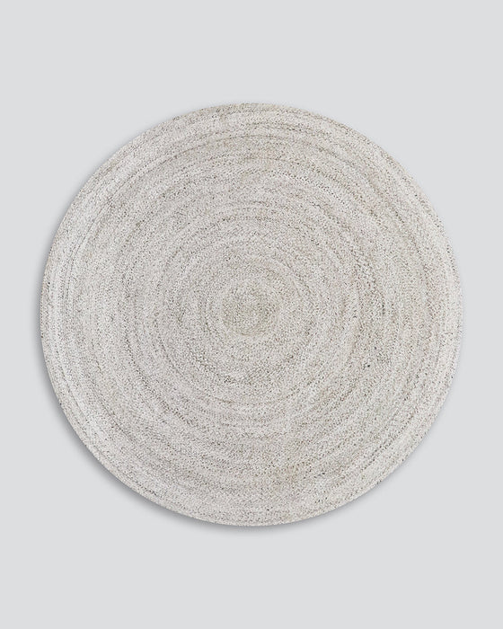 Mornington Round Floor Rug in Pale Sand, the whole round rug shown flat on a plain background
