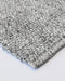 Nebraska Floor Rug in Ash, close-up of a corner showing the edge and wool and viscose pile