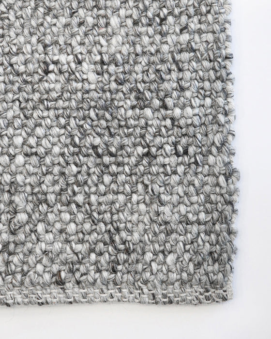 Nebraska Floor Rug in Ash, close-up of a corner showing the edge and wool and viscose pile
