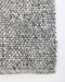 Nebraska Floor Rug in Ash, close-up of a corner showing the edge and wool and viscose pile