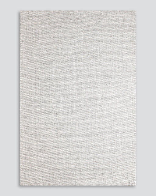 Nebraska Floor Rug in Natural White, the whole rug shown flat on a plain background
