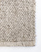 Nebraska Floor Rug in Pebble, close-up of a corner showing the edge and wool and viscose pile
