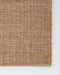 Ormond Floor Rug in Biscotti, close-up of a corner showing the edge and recycled PET pile