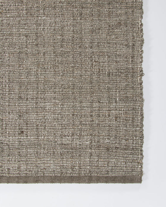 Ormond Floor Rug in Mineral, close-up of a corner showing the edge and recycled PET pile
