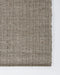 Ormond Floor Rug in Mineral, close-up of a corner showing the edge and recycled PET pile
