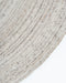 Palm Cove Round Floor Rug in Sand, close-up of the curved edge and recycled PET weave
