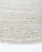 Palm Cove Round Floor Rug in Sand, close-up of the curved edge and recycled PET weave