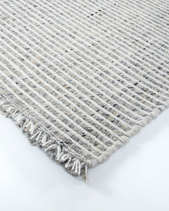 Rhodes Floor Rug in Slate, close-up of a corner showing the edge and recycled PET pile