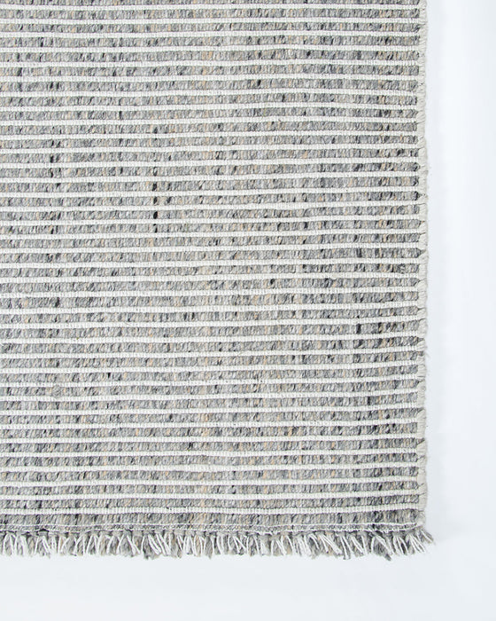 Rhodes Floor Rug in Slate, close-up of a corner showing the edge and recycled PET pile