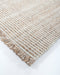 Rhodes Floor Rug in Teak, close-up of a corner showing the edge and recycled PET pile