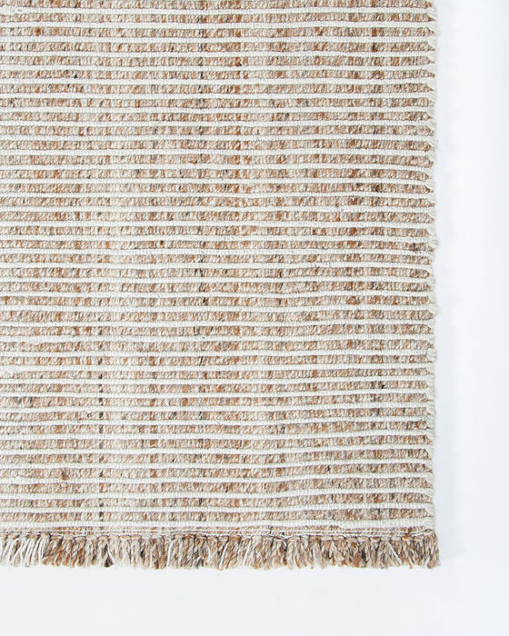 Rhodes Floor Rug in Teak, close-up of a corner showing the edge and recycled PET pile