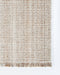 Rhodes Floor Rug in Teak, close-up of a corner showing the edge and recycled PET pile