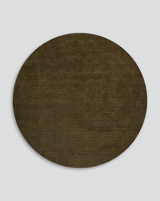 Sandringham Round Floor Rug in Moss, the whole round rug shown flat on a plain background