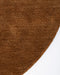 Sandringham Round Floor Rug in Pecan, close-up of the curved edge and wool weave
