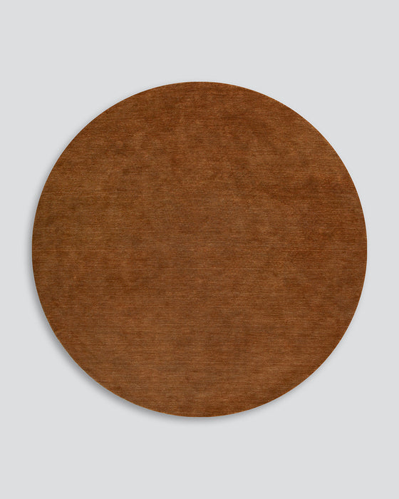 Sandringham Round Floor Rug in Pecan, the whole round rug shown flat on a plain background