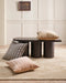 Corbett Floor Rug in Honey, in a panelled room with a dark timber bench and striped cushions