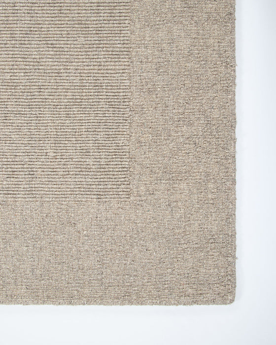 Vermont Floor Rug in Driftwood, close-up of a corner showing the edge and wool pile