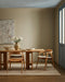 Vermont Floor Rug in Sand, under a timber dining table with matching chairs in a beige room